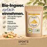 SPINTZ Bio-Ingwer-Kapseln mit veganer Kapselhülle zur einfachen Einnahme, neben frischer Ingwerwurzel.
