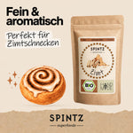 SPINTZ Bio-Ceylon-Zimt, fein gemahlen, neben einer illustrierten Zimtschnecke.