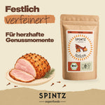 SPINTZ Bio-Nelken für herzhafte Gerichte, dargestellt mit einem mit Nelken gespickten Schinken.