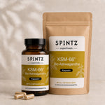 SPINTZ KSM-66 Bio-Ashwagandha Kapseln in Glas und Nachfüllbeutel vor natürlichem Hintergrund